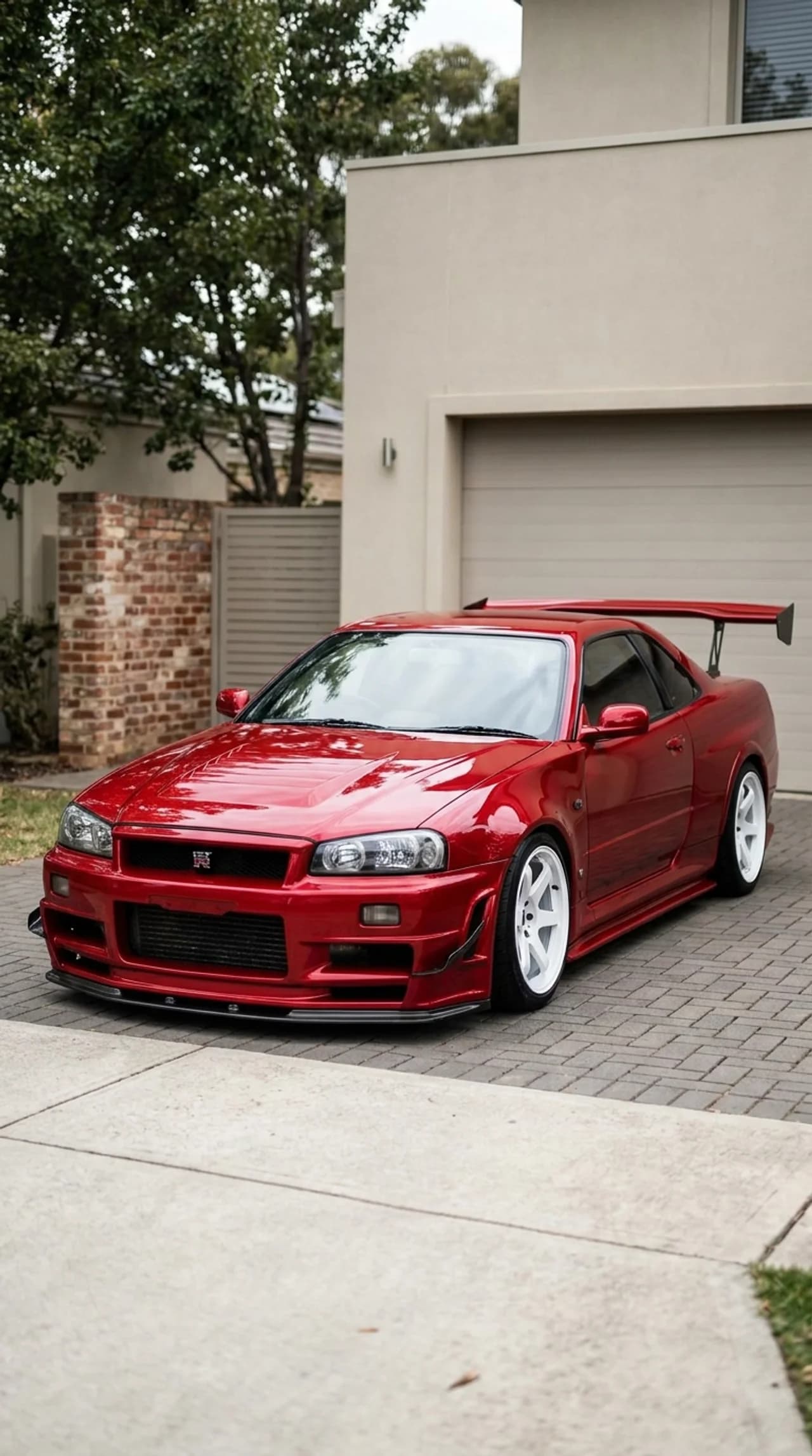 Nissan Skyline R34 GT-R - Red Legend in the Driveway